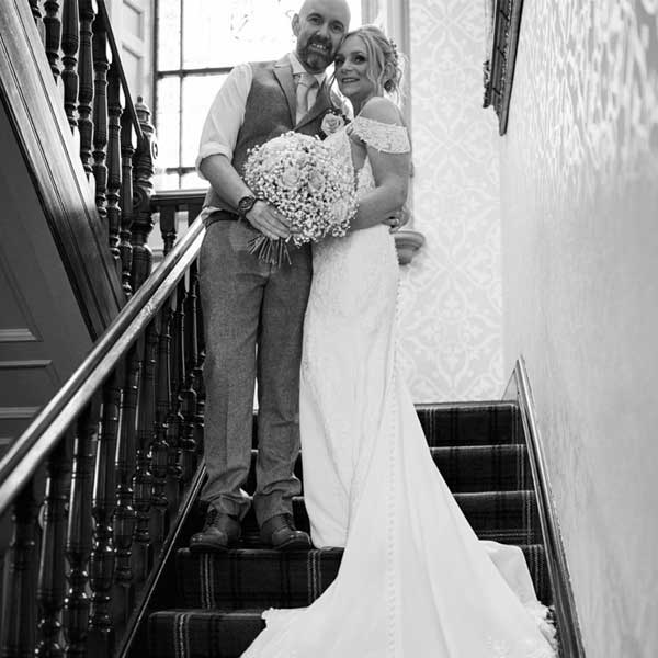 Couple on stairs getting married